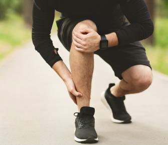 male runner suffering from lateral ankle pain 