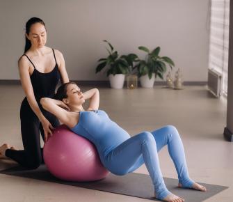 pregnant woman with physical therapist