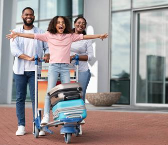 family traveling with suitcases
