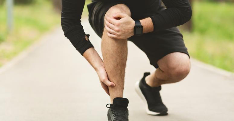 male runner suffering from lateral ankle pain 