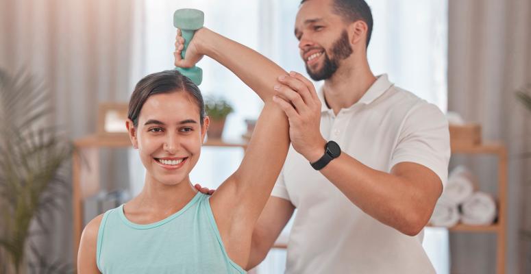 woman receiving physical therapy for shoulder injury